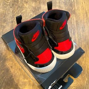 Jordan 1 crib bootie. Color red & black size 2c. Worn once. Great condition.